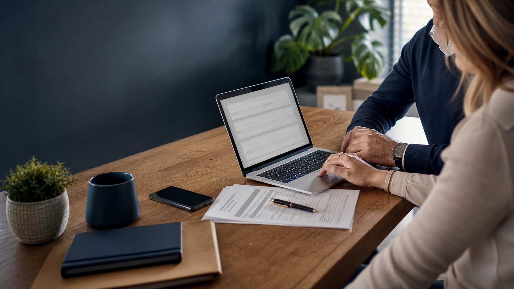 Client completing a digital insurance quotation with an adviser